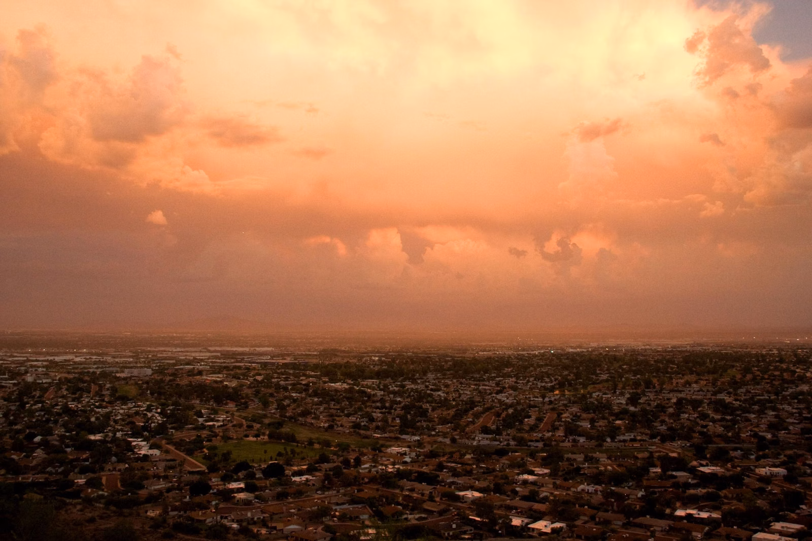 Sunset glow and clouds over the Phoenix valley from South Mountain
